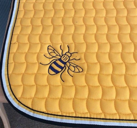 Yellow numnah with Manchester bee embroidery